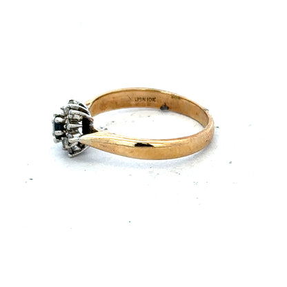 9ct gold diamond ring featuring a sparkling central diamond and a classic band design.