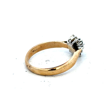 9ct gold diamond ring with a simple band and sparkling diamonds, showcasing elegant jewelry design.