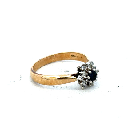 9ct gold diamond ring with a sparkling central diamond and elegant design, showcasing fine craftsmanship and luxury.