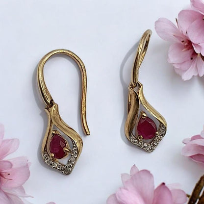 9ct gold Ruby earrings with central gemstones, elegant stud design, unbranded jewelry for sophisticated style.