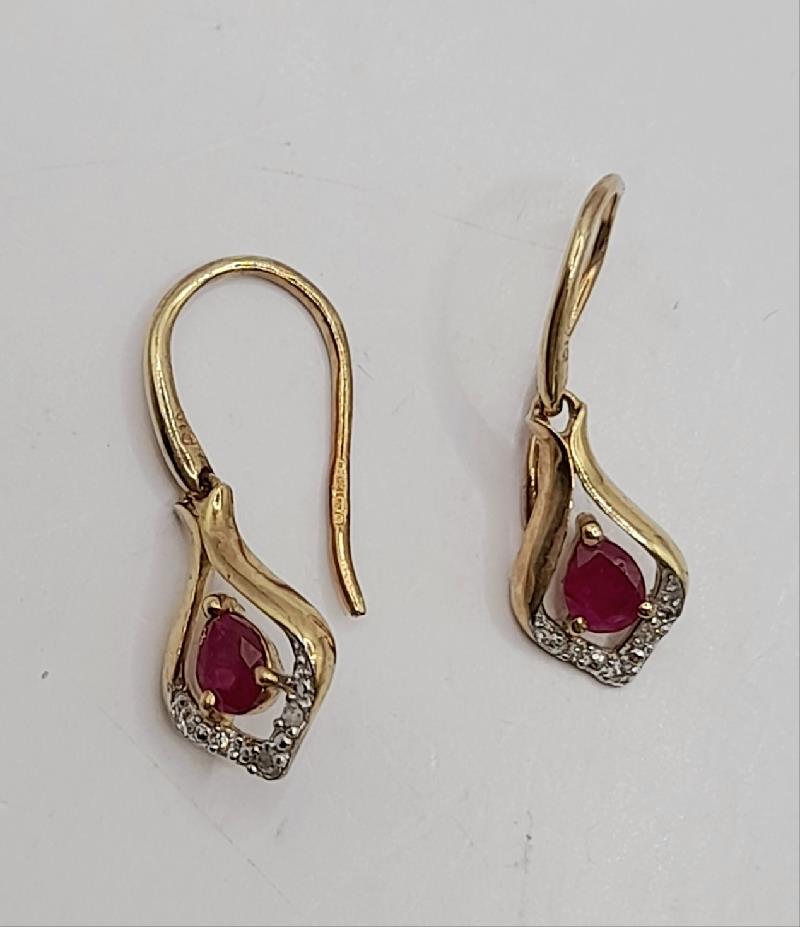 9ct gold ruby earrings featuring vibrant red gemstones and classic design, perfect for elegant jewelry styling.