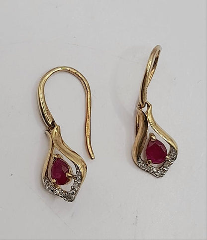 9ct gold ruby earrings featuring vibrant red gemstones and classic design, perfect for elegant jewelry styling.
