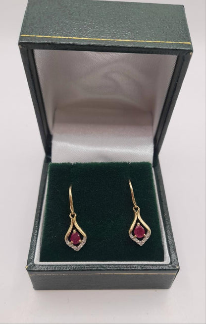 9ct gold Ruby earrings with vibrant red gemstones, elegant and stylish jewelry accessory.