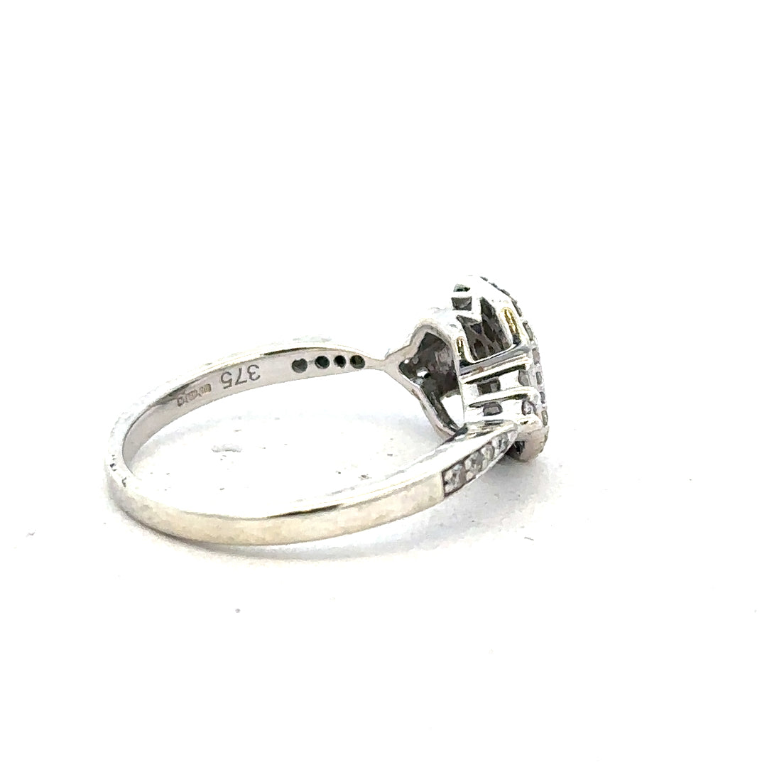9ct white gold diamond ring with 0.35 carats, size J, featuring a central diamond and elegant band design.