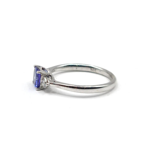 9ct white gold ring with 0.70 carat tanzanite and diamond accents, showcasing a elegant jewelry design.