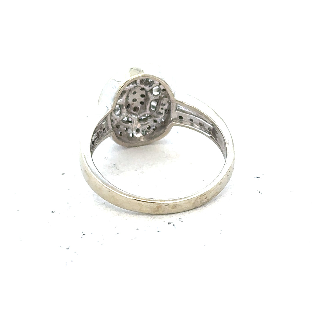 9ct white gold diamond ring with 1/2 carat center stone, size P, featuring a sleek design and sparkling diamonds.