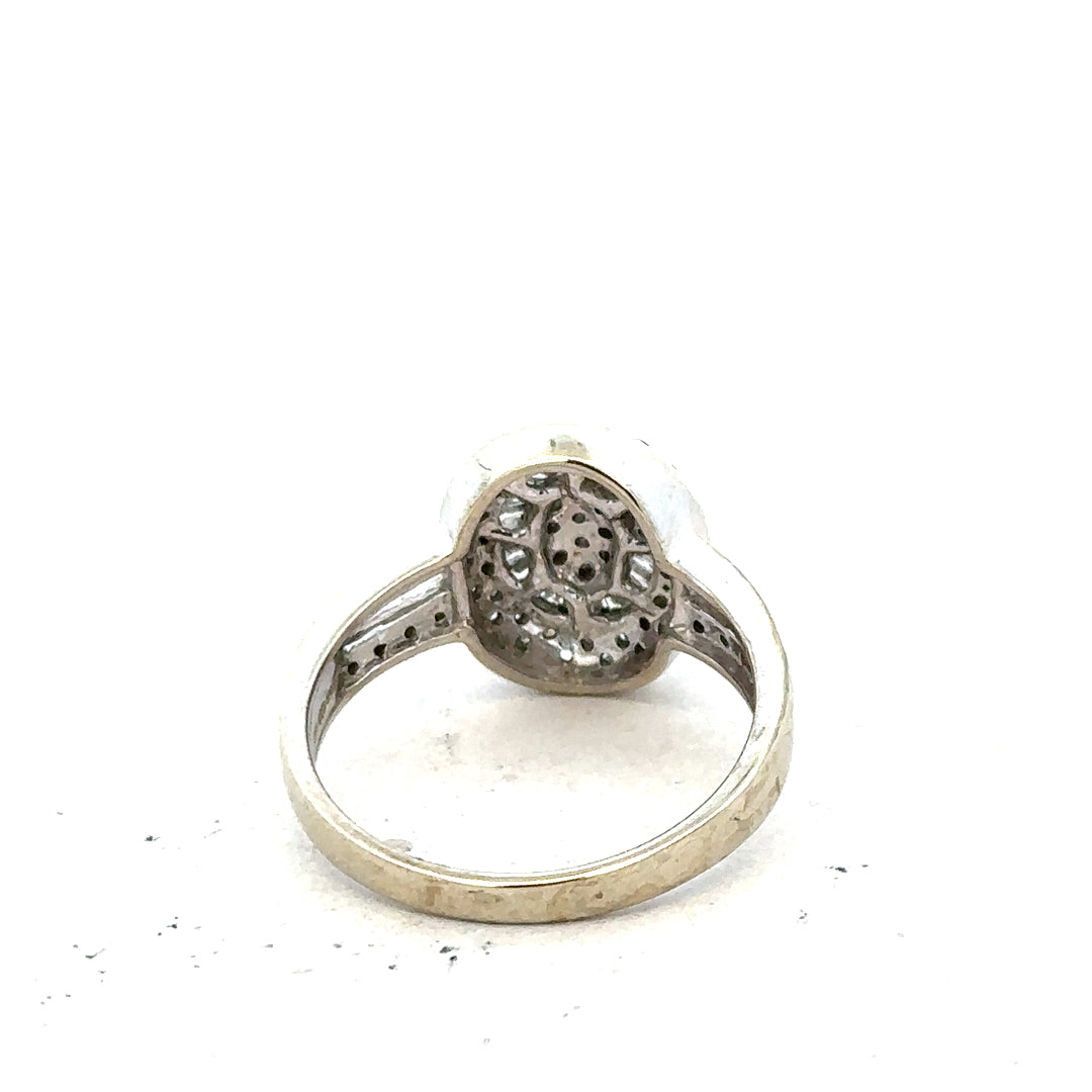 9ct white gold diamond ring with 1/2 carat center stone in size P on a white background