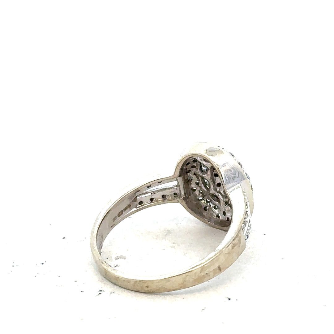9ct white gold diamond ring with 1/2 carat center stone, size P, featuring a sleek and elegant design.