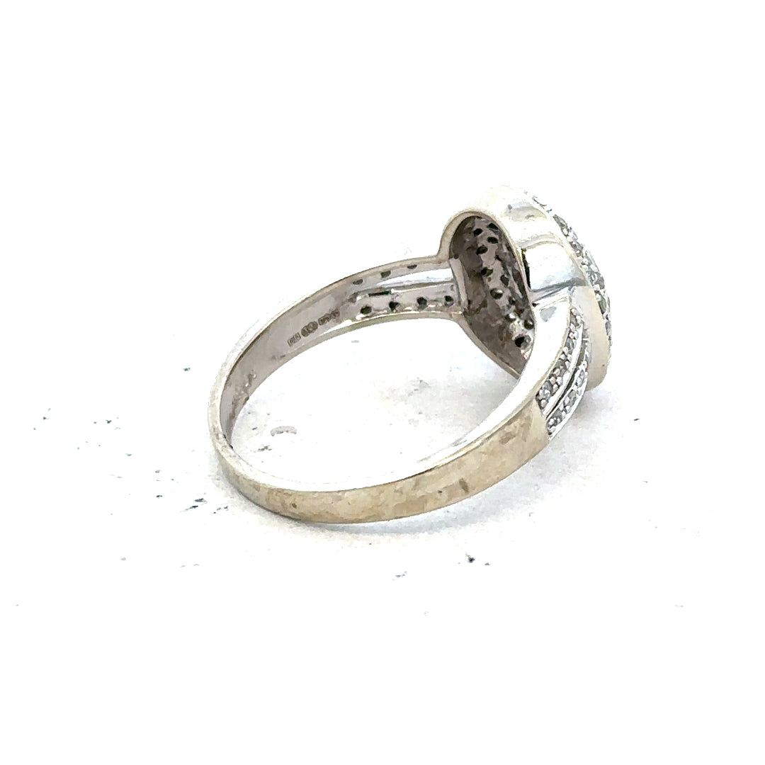 9ct white gold diamond ring with 1/2 caret center stone, size P, featuring a sleek and elegant design.