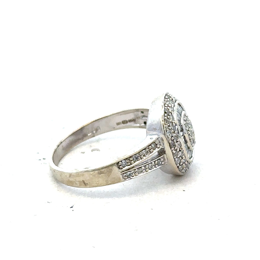 9ct white gold diamond ring with 1/2 carat round diamonds, size P, featuring a sleek and elegant design.