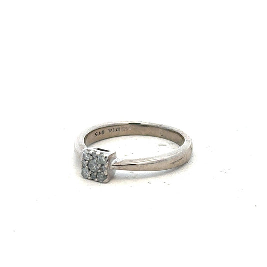 9ct white gold diamond ring with 15pts of diamonds in size K1/2, featuring a sleek and elegant design.
