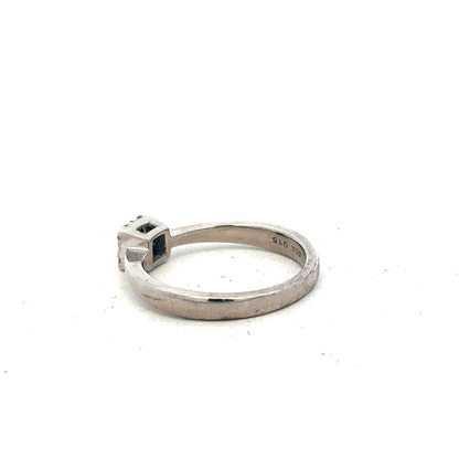 9ct white gold diamond ring with 15pts of diamonds in size K1/2, showcasing the elegant band and sparkling stones.