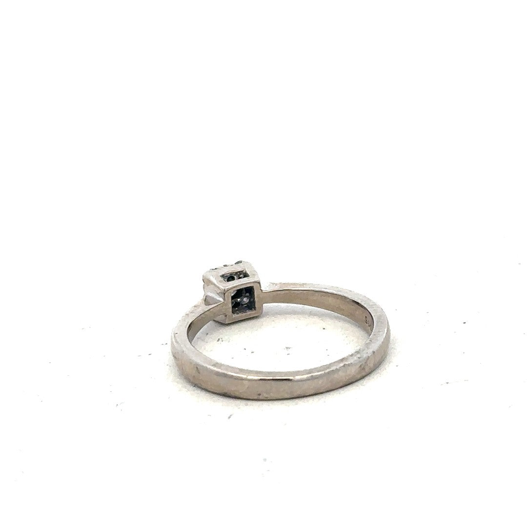 9ct white gold diamond ring with 15pts of diamonds in size K1/2, featuring a sleek, elegant design.