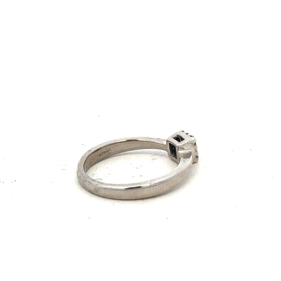 9ct white gold diamond ring with 15pts of diamonds in size K1/2, featuring a sleek, elegant design.