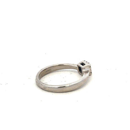 9ct white gold diamond ring with 15pts of diamonds in size K1/2, featuring a sleek, elegant design.