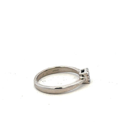 9ct white gold diamond ring with 15pts of diamonds in size K1/2, featuring a sleek design and sparkling stone details.