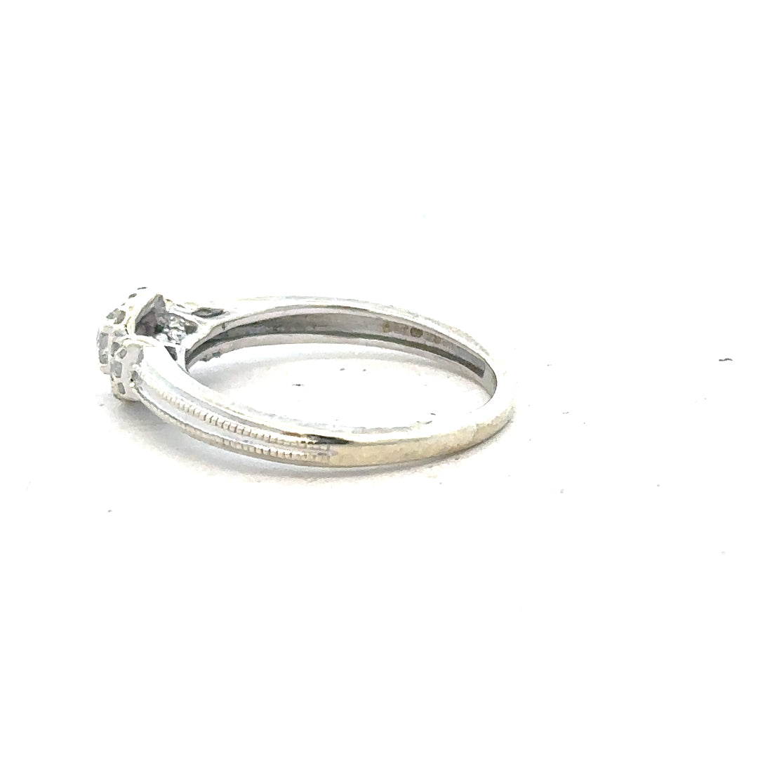 9ct white gold diamond ring with 20pts (0.20 carats) in size K1/2, featuring a sleek, elegant design.