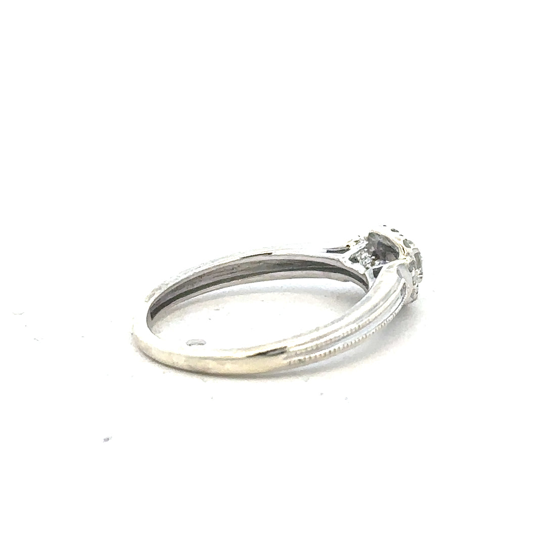 9ct white gold diamond ring with 20pts sparkling diamonds in size K1/2, showcasing elegant jewelry craftsmanship.