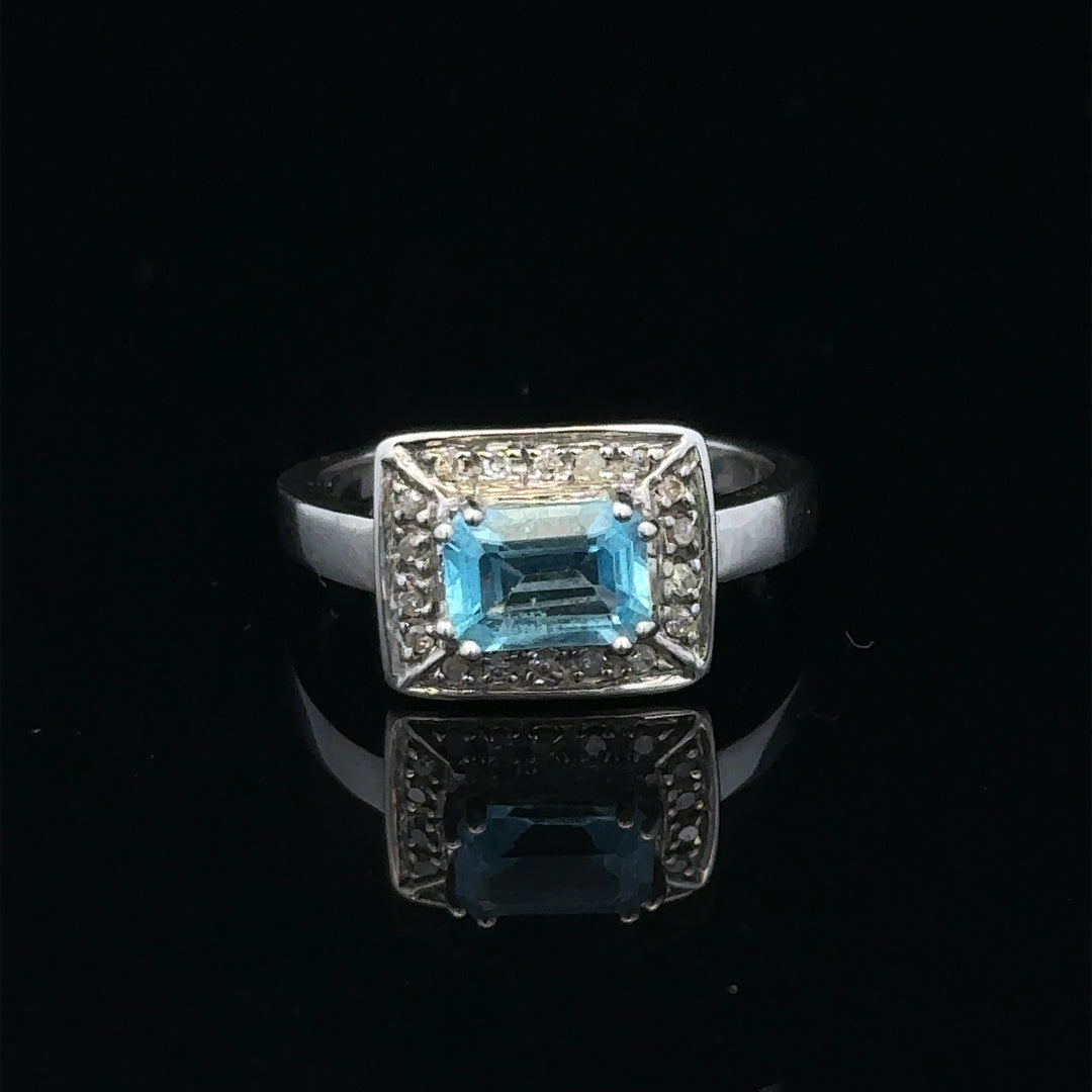 9ct white gold diamond ring in size L, featuring a sparkling central diamond and intricate band design.