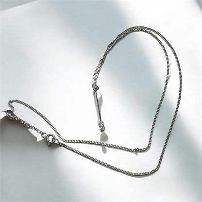 9ct white gold chain with an 18ct white gold diamond pendant, total weight 3.5g, showcasing elegant jewelry design.
