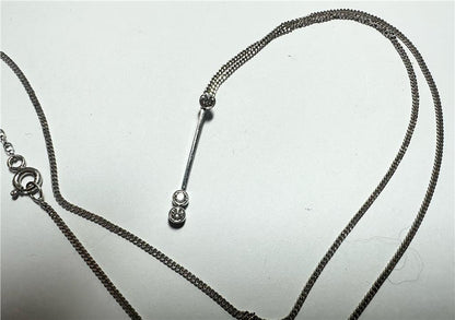 9ct white gold chain with 18ct white gold diamond pendant, elegant jewelry piece, weighs 3.5g, unbranded.