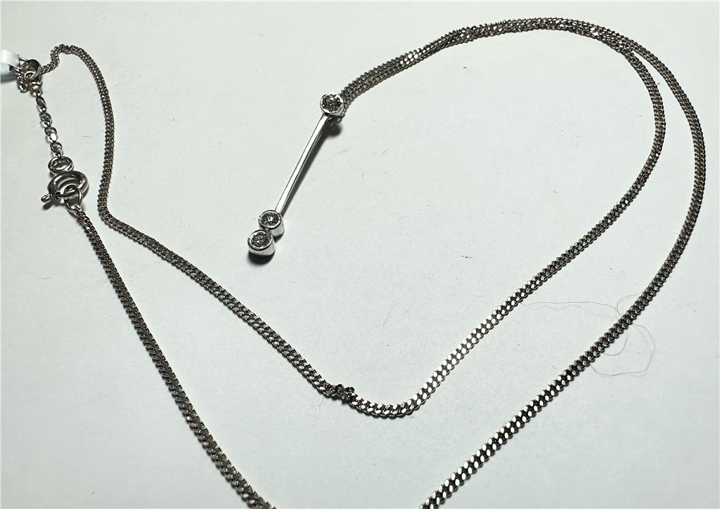 9ct white gold chain with an 18ct white gold diamond pendant, weighing 3.5g, elegant jewelry piece with sparkling diamonds.