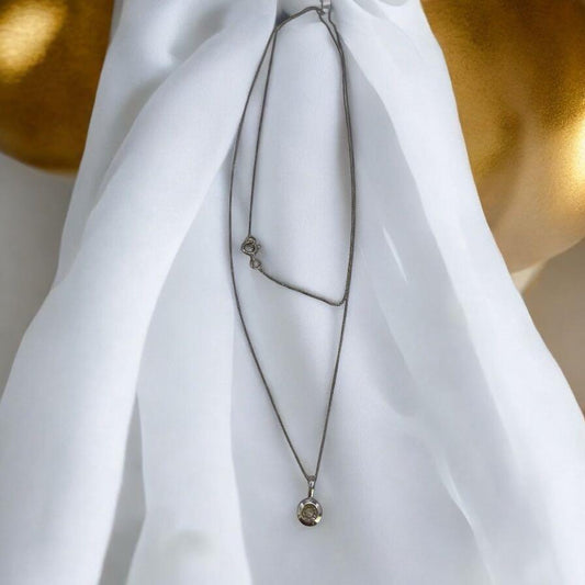 9ct white gold chain with matching pendant, featuring a simple elegant design, unbranded jewelry accessory.