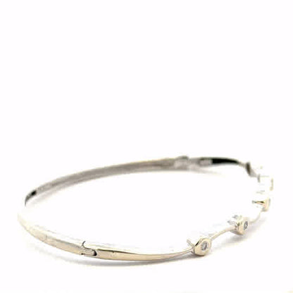 9ct white gold diamond bangle with sparkling diamonds, showcasing elegant design and craftsmanship, weight 7.7g.