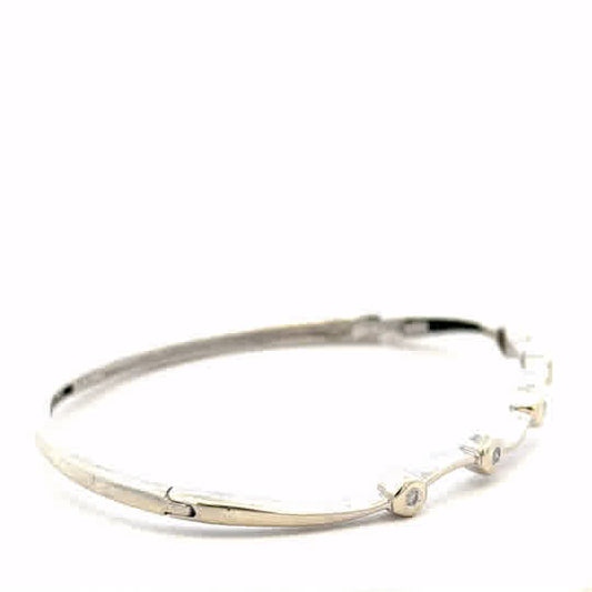 9ct white gold diamond bangle with sparkling diamonds, showcasing elegant design and craftsmanship, weight 7.7g.