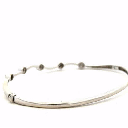 9ct white gold diamond bangle with sparkling diamonds, lightweight and elegant jewelry piece, unbranded.