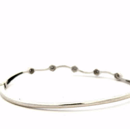 9ct white gold diamond bangle with sparkling diamonds, weight 7.7g, featuring a sleek and elegant design.