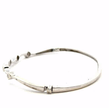 9ct white gold diamond bangle with sparkling diamonds, weighing 7.7g, elegant jewelry piece featuring a sleek design