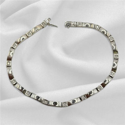 9ct white gold diamond bracelet with delicate design, weighs 8.6g, 8-inch length, featuring sparkling diamonds.