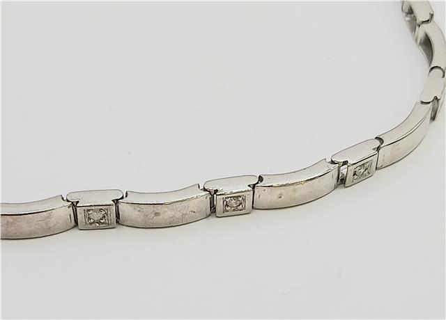 9ct white gold diamond bracelet with delicate design, 8 inches long, showcasing sparkling diamonds on a fine jewelry piece.