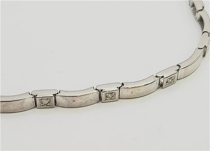 9ct white gold diamond bracelet with delicate design, 8 inches long, showcasing sparkling diamonds on a fine jewelry piece.