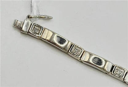 9ct white gold diamond bracelet with sparkling diamonds, 8 inches long, weighing 8.6 grams, showcasing elegant jewelry design