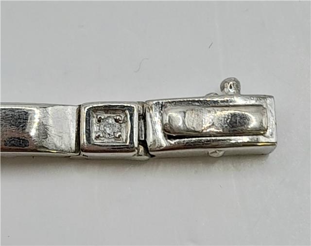 9ct white gold diamond bracelet with delicate design, weighing 8.6g and measuring 8 inches, displayed on a neutral background.