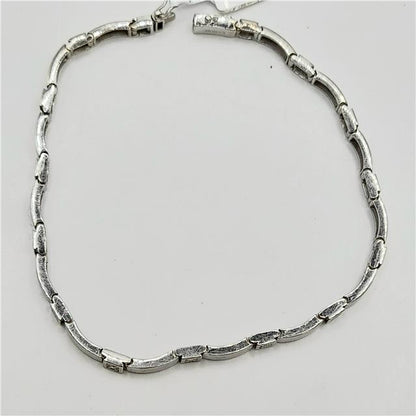 9ct white gold diamond bracelet with sparkling diamonds, 8 inches long, weighing 8.6 grams, unbranded jewelry accessory.