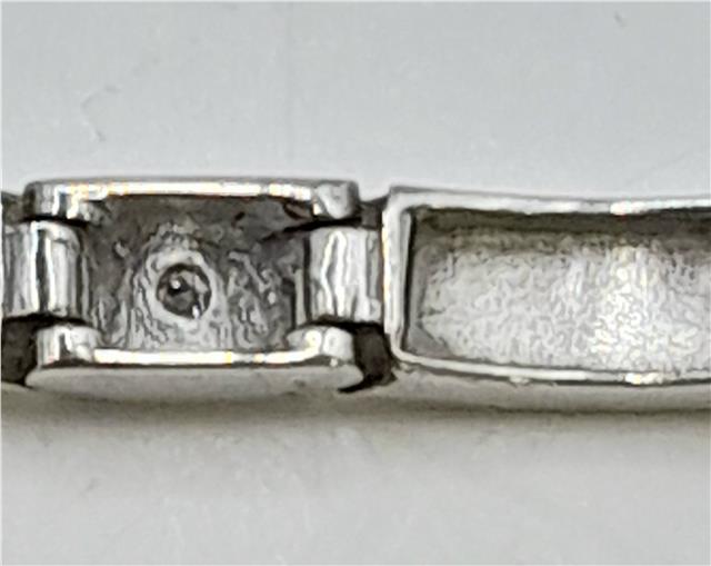9ct white gold diamond bracelet with delicate design, 8 inches long, weighing 8.6 grams, featuring sparkling diamonds.