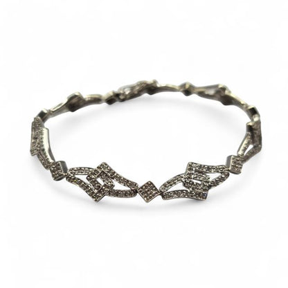 9ct white gold diamond bracelet with sparkling stones, elegant jewelry piece, unbranded, displayed on a white background.