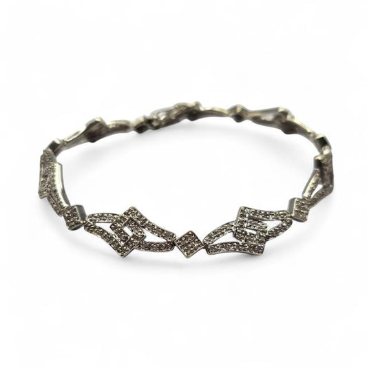 9ct white gold diamond bracelet with sparkling stones, elegant jewelry piece, unbranded, displayed on a white background.