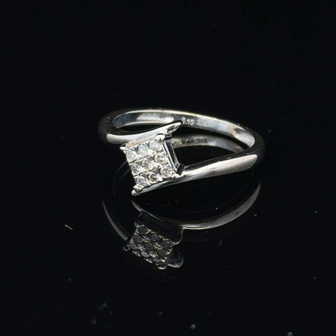 9ct white gold diamond cluster ring with a 10-point diamond, featuring a sparkling and elegant design.
