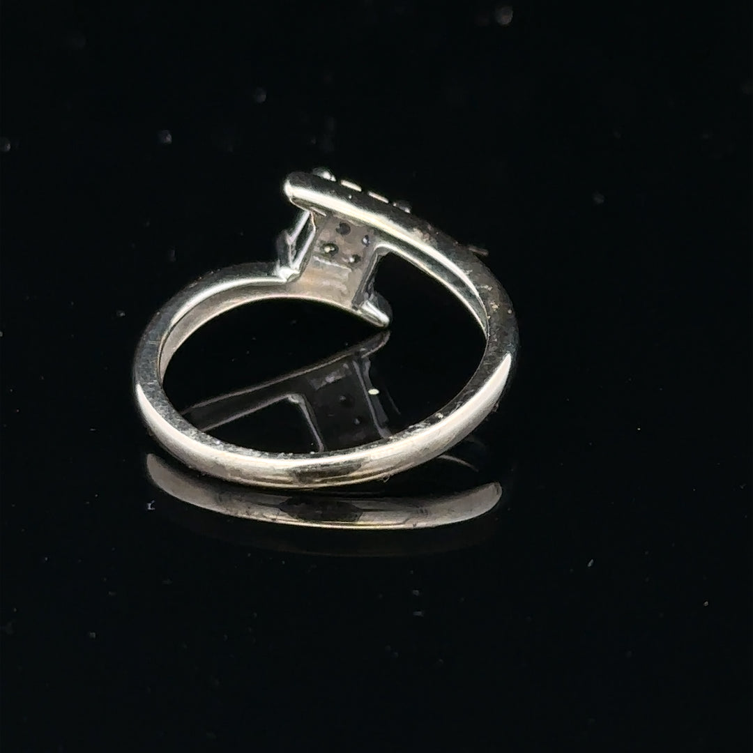9ct white gold diamond cluster ring featuring a 10-point diamond, showcasing elegant craftsmanship and sparkling gemstone details.