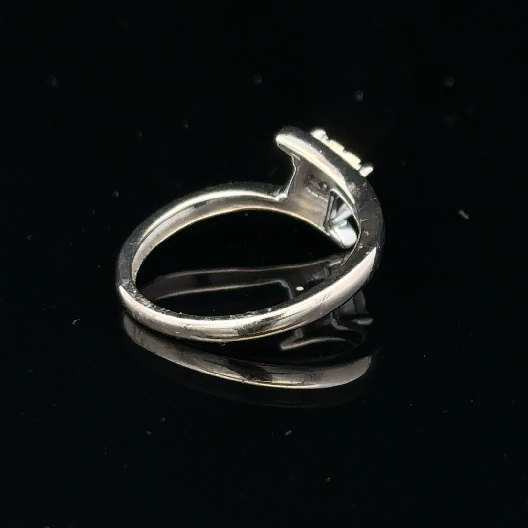 9ct white gold diamond cluster ring with a 10-point sparkling diamond, showcasing elegant jewelry craftsmanship.