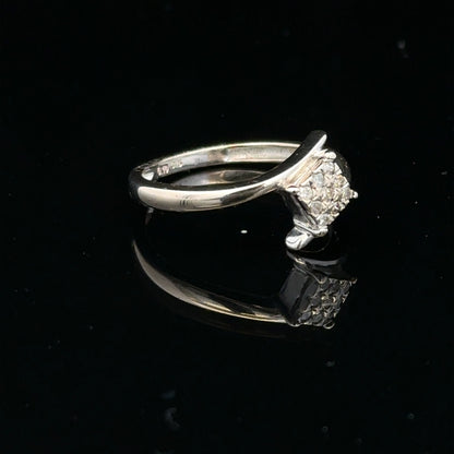 9ct white gold diamond cluster ring with a 10-point sparkling diamond, showcasing elegant jewelry craftsmanship.