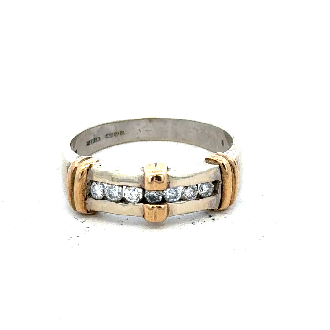 9ct white gold diamond ring with a central sparkling diamond and elegant band, showcasing fine craftsmanship.