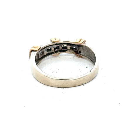 9ct white gold diamond ring with a sparkling central diamond and delicate band, showcasing elegant jewelry design.