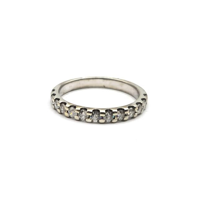 9ct white gold diamond ring with a central sparkling diamond, showcasing elegant craftsmanship and classic design.
