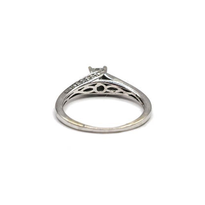 9ct white gold diamond ring with a central diamond, elegant jewelry piece featuring a sleek band and sparkling gemstones.