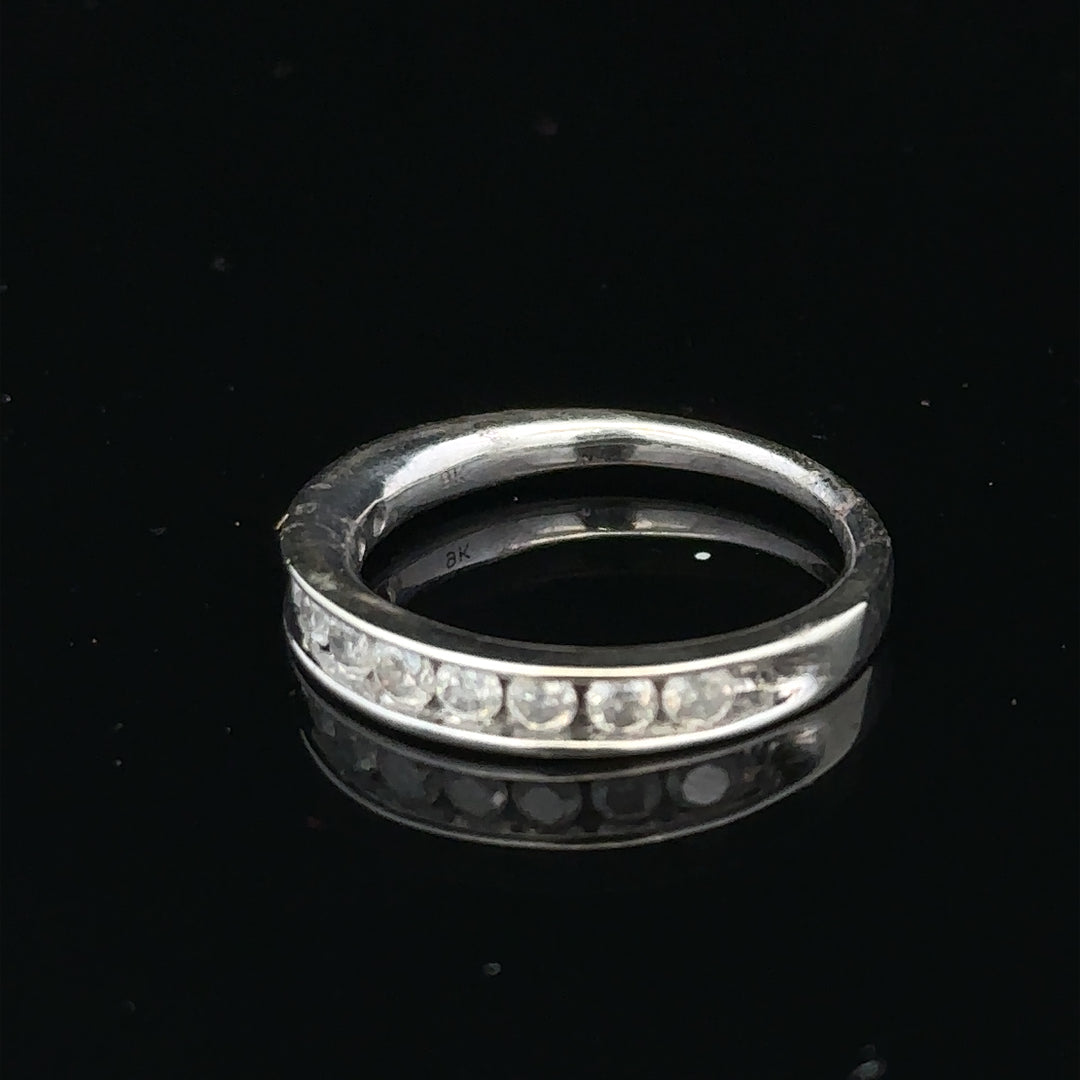9ct white gold diamond ring in size J with a sparkling central diamond and elegant band design